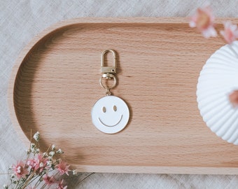 Porte-clés smiley en métal en blanc