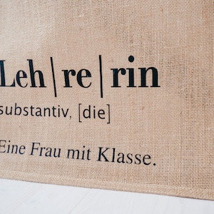 Jutetasche Lehrerin Jute beige, Aufdruck "Eine Frau mit Klasse" im Lexikon-Stil