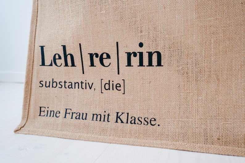 Jutetasche Lehrerin Jute beige, Aufdruck "Eine Frau mit Klasse" im Lexikon-Stil