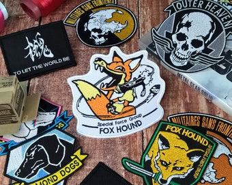 Metal Gear – Gestickter Aufnäher – FOX Hound – DIAMOND Dogs – MSF – Outer Heaven – To Let The World Be – Videospiel-Emblem – Premium-Stickerei