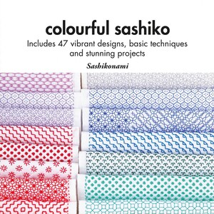 May include: A book titled "colourful sashiko" with a colorful display of 47 vibrant sashiko designs, basic techniques, and stunning projects. The book cover features a colorful display of sashiko embroidery designs.