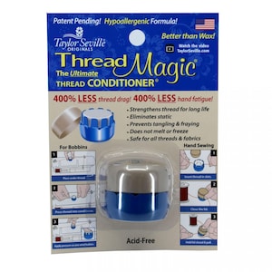 May include: Thread Magic The Ultimate Thread Conditioner, a blue and silver plastic container with a white label that says "400% LESS thread drag! 400% LESS hand fatigue!" and lists the benefits of using the product. The product is acid-free and is for use with bobbins and hand sewing.
