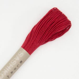 May include: A spool of red embroidery floss with the text "Sashiko" and "刺し子" in Japanese on the label.
