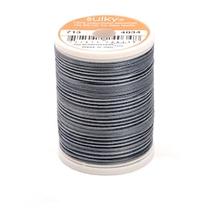 May include: A spool of Sulky 100% cotton mercerized thread in color 4034. The spool is labeled with the Sulky logo, the thread number, and the color number. The thread is a dark gray with white stripes.