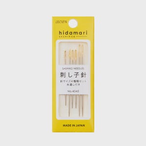 May include: A yellow and white package of sashiko needles. The package says "hidamari SASHIKO&" and "刺し子針" which translates to "Sashiko needles". The package also says "針サイズ4種類セット" which translates to "4 sizes of needles set".
