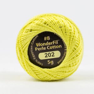 May include: A yellow spool of size 8 WonderFil Perle Cotton thread, labeled with the number 202 and 5g. The label also states that the thread is 100% Egyptian cotton, double gassed and mercerized.