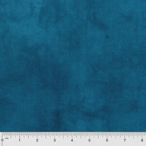 May include: Teal-colored fabric with a mottled appearance. The fabric has a soft, velvety texture and a subtle sheen. A ruler is placed at the bottom of the image, with measurements in inches.