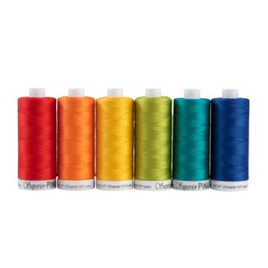 May include: Six spools of Superior Pima cotton thread in a rainbow of colors: red, orange, yellow, green, teal, and blue. Each spool is labeled with the brand name and thread weight. The spools are arranged in a row against a white background.