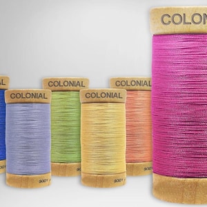 May include: Six spools of thread in various colors, including blue, purple, green, yellow, orange, and pink. Each spool is labeled "COLONIAL 300Y".