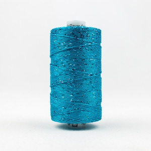 May include: A spool of turquoise metallic thread.