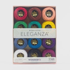 May include: A box set of 12 spools of WonderFil #8 Perle Cotton thread in various colors. The box features the word "ELEGANZA" and the text "100% Egyptian Cotton Double Gassed". Each spool contains 42 yards (38m) of thread.