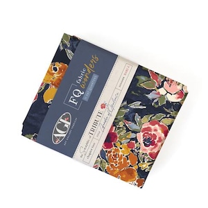 May include: A stack of fabric fat quarters with a floral pattern in shades of red, orange, and pink on a navy blue background. The fabric is wrapped with a blue label that reads "FQ fabric wonders" and "The Season of Tribute".