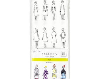 May include: A rectangular package of white fabric featuring black line drawings of figures in various dresses. The label includes the text LECIEN 100, White, and 40x52cm. Below the label, four figures are printed in color, wearing patterned outfits.