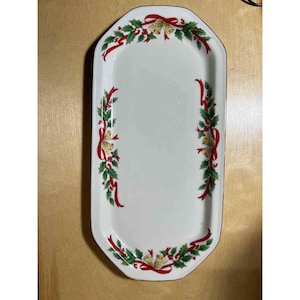 May include: A white ceramic mug with a black handle and the text "But First, Coffee" in a handwritten style. The mug is on a white surface. The mug is approximately 4 inches tall.