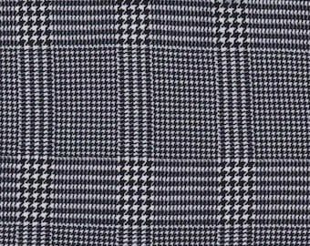 May include: Black and white houndstooth patterned fabric. The pattern is a classic plaid with a small, repeating houndstooth design.