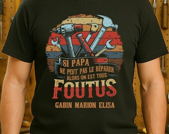 May include: Black t-shirt with a graphic of tools and the text "SI PAPA NE PEUT PAS LE REPARER ALORS ON EST TOUS FOUTUS" in red and white. The names GABIN MARION ELISA are below the text.