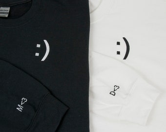 sweatshirt with initial on sleeve