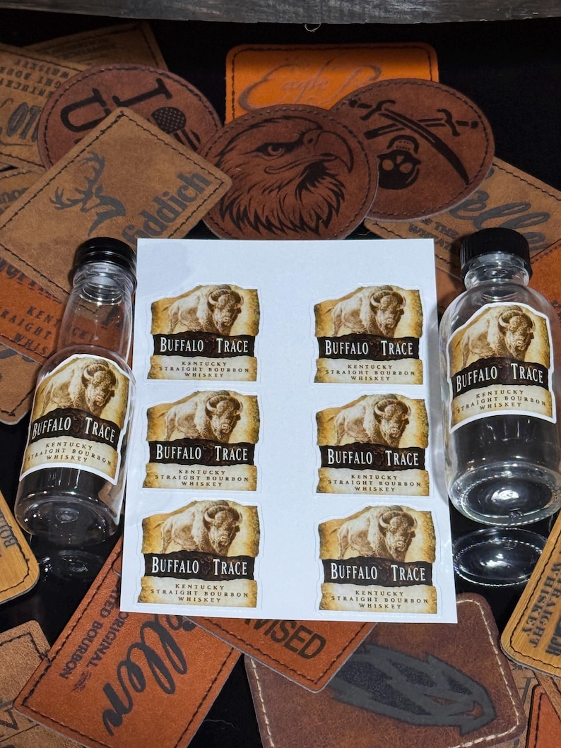 May include: Eight miniature bottles of Buffalo Trace Kentucky Straight Bourbon Whiskey. Each bottle has a label with a brown buffalo illustration and the brand name.