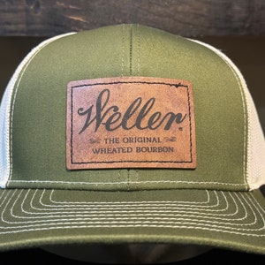 May include: A green and white trucker hat with a brown leather patch that says "Weller, The Original Wheated Bourbon."