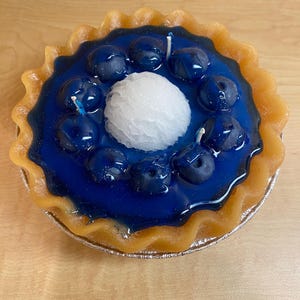 Vela de pastel de arándanos