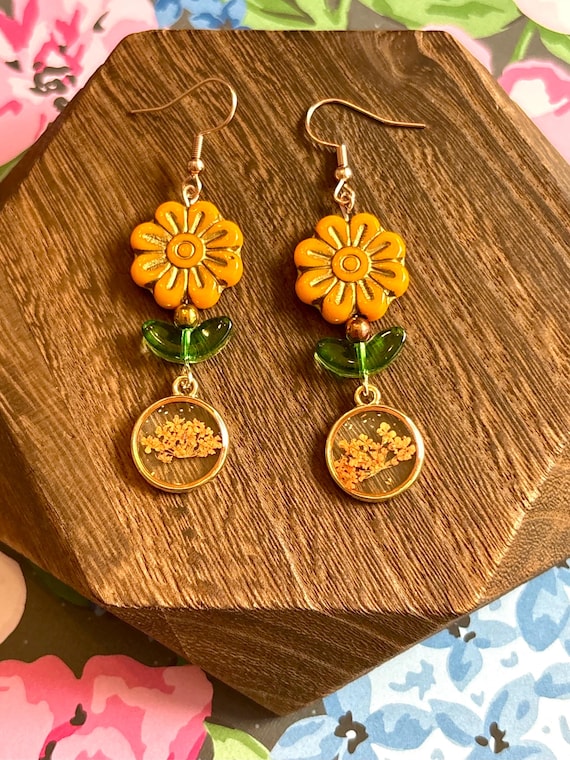 Marigold Whispers Earrings – Czech Glass Flowers, Green Leaves, Hematite and Dried Floral Resin Charms – 2.75” Handmade Earrings