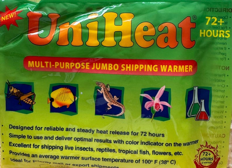 May include: A green UniHeat multi-purpose jumbo shipping warmer package with orange and yellow text. The bag features illustrations of a grasshopper, a yellow fish, a lizard, a pink flower, and laboratory glassware, with a 72+ hours heat duration.