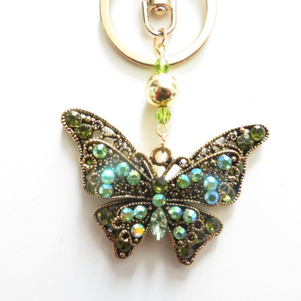 Bijou de sac papillon or et strass vert, porte-clés papillon