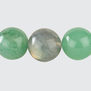 May include: Three round beads, one green, one grey, and one green. The beads are smooth and polished.