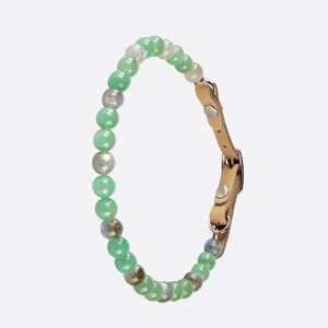 May include: A green and grey beaded pet collar with a brown leather strap and silver buckle.