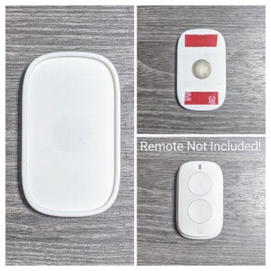 May include: White round remote control holder with a white remote control with two buttons. The text "Remote Not Included!" is printed on the image.