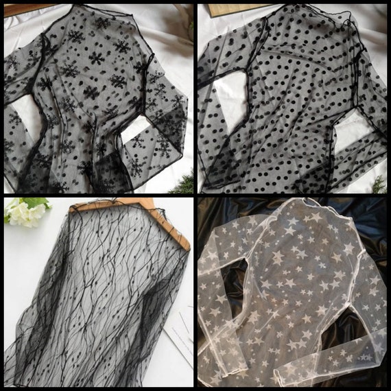 blusa negra transparente con estrellas