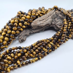 Round Tiger Eye bead in genuine semi-precious natural stone, caliber 6 and 8 mm for manufacturing, creation of jewelry