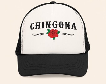 May include: A black and white trucker hat featuring a white front panel with the black text CHINGONA printed in a bold font above a red rose graphic with green leaves and two black decorative flourishes on either side of the flower.