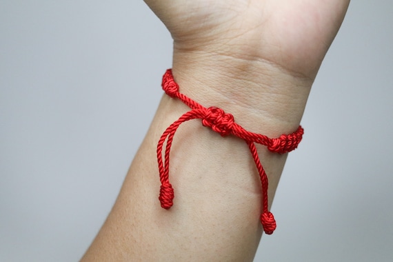 Red cross bracelet meaning deals