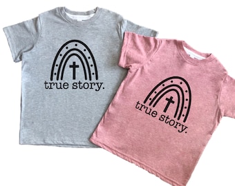 Camiseta de Pascua para niños con la historia real: Él ha resucitado. Camiseta religiosa para niñas, niños, bebés y niños pequeños. Camiseta cristiana de Pascua para niños.