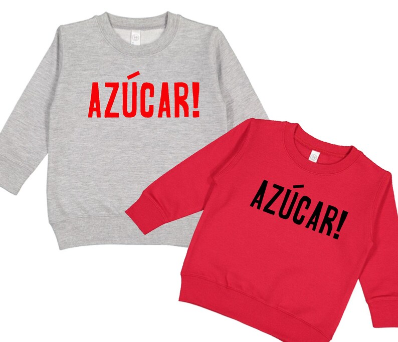 May include: Two long-sleeved sweatshirts with the word "AZ&Uacute;CAR!" printed on the front. One sweatshirt is gray and the other is red.
