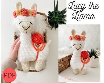 May include: A white crocheted llama wearing a flower crown with orange, pink, and yellow flowers. The llama has a red and orange saddle with a pom-pom on top. The text "Lucy the Llama" is written in black above the llama. The image is labeled "PDF".