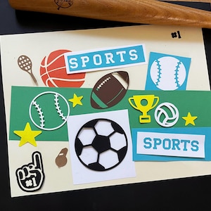 May include: A collage of sports-themed cutouts, including a basketball, baseball, football, soccer ball, and a trophy. The word "SPORTS" is displayed on blue rectangles. A baseball bat is in the background.