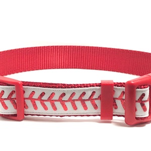 May include: Red and white dog collar with a baseball stitch design.