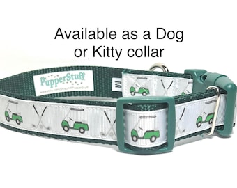 May include: Green and white dog or kitty collar with a golf theme. The collar features a green background with a white ribbon adorned with golf carts and crossed golf clubs. The text "Available as a Dog or Kitty collar" is visible.