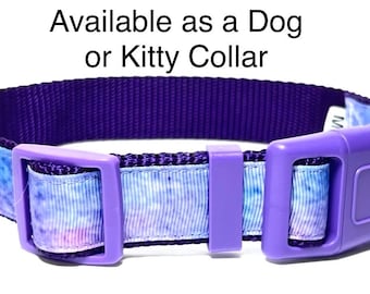 May include: A purple pet collar with a matching purple plastic buckle. The collar has a blue and white watercolor design. Text on the image reads: "Available as a Dog or Kitty Collar."