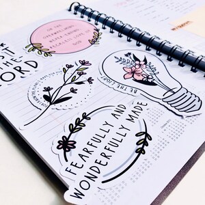 May include: A collection of stickers with inspirational quotes and floral designs. The stickers feature phrases like "For I know the plans I have for you", "Be the light", "Fearfully and wonderfully made", and "On the overwhelming, never-ending, reckless love of God".