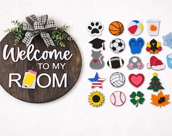 May include: A round wooden sign with the words "Welcome to my Room" in white lettering. The sign is decorated with a bow and greenery. A collection of decorative magnets in various shapes and colors are displayed to the right.