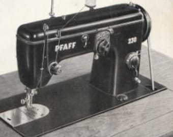 May include: A black Pfaff 230 sewing machine with a white label on the front. The machine is sitting on a wooden table.