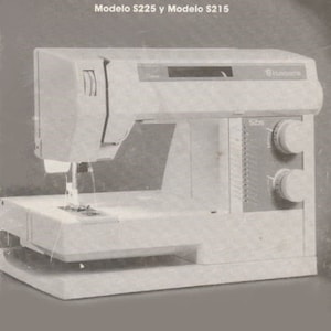 May include: A white sewing machine with a black control panel and a silver needle. The machine has a brand name "Husqvarna" on the front. The text "Operating manual Model $225 and Model $215" and "Manual de instrucciones Modelo $225 y Modelo $215" is printed on the page.