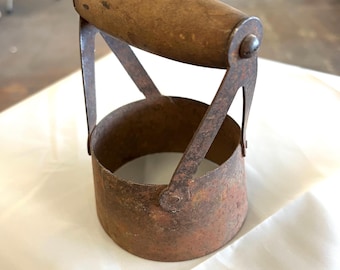 Vintage biscuit cutter with wooden handle