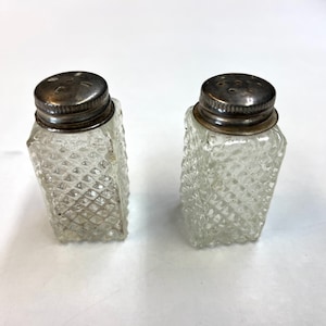 Vintage textured glass salt and pepper shakers.