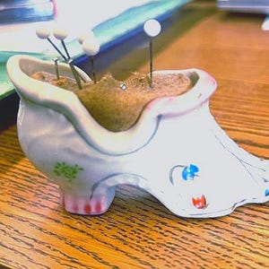 Porcelain shoe pincushion made in Occupied Japan