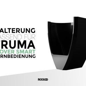 May include: Black holder for a Truma Mover Smart remote control. The holder is made of plastic and has a silver trim. The text "Halterung passend f&uuml;r Truma Mover Smart Fernbedienung" is printed on a white background.