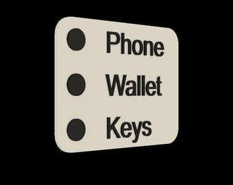 May include: A white checklist with three black circles and the words "Phone", "Wallet", and "Keys" written in black.